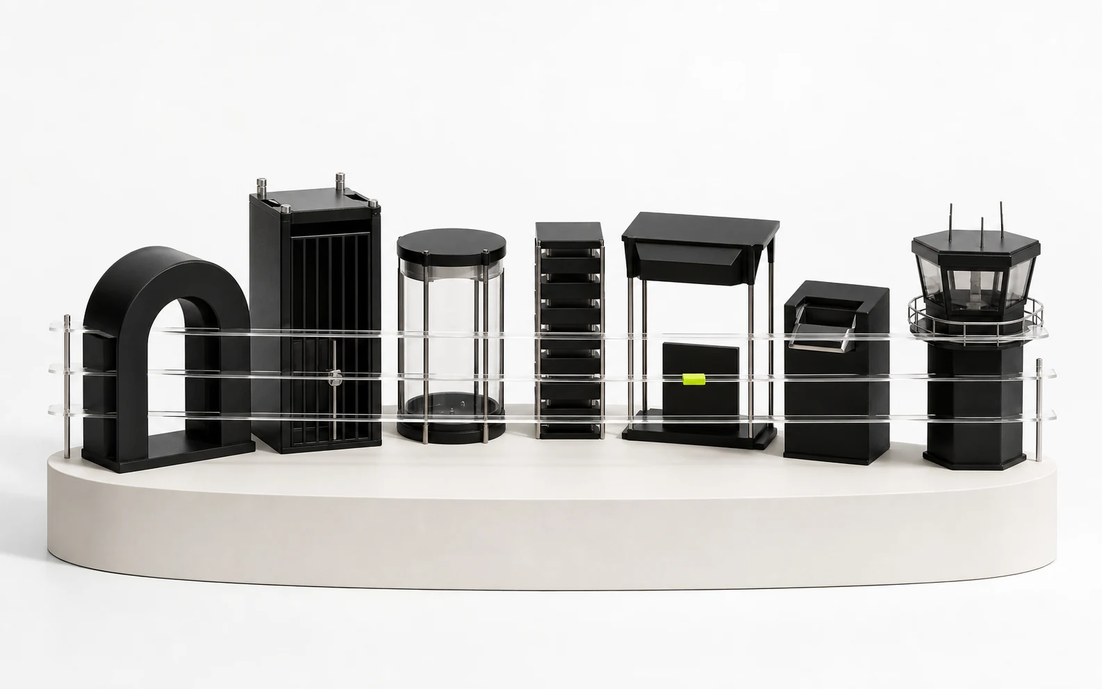 Seven different black platform structures stand behind four clear calibration rails on a white semicircular plinth.