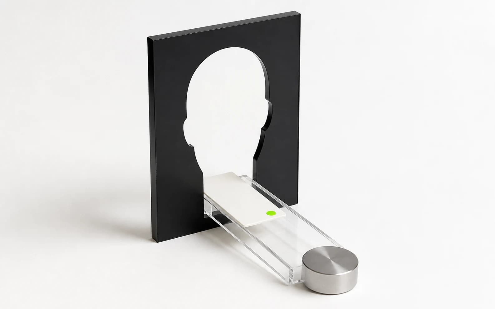 An empty head-shaped aperture stands over a verified clip card traveling toward a metal payout puck.