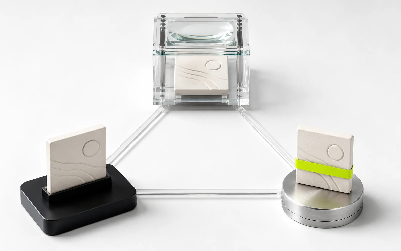 Three matching ceramic content plates form a triangle between a black submission plinth, a clear inspection chamber, and a steel payout puck.