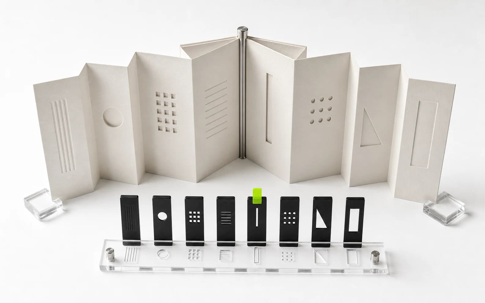 An eight-facet folded paper brief aligns a row of varied black clip tiles, with one tile receiving a lime approval tab.